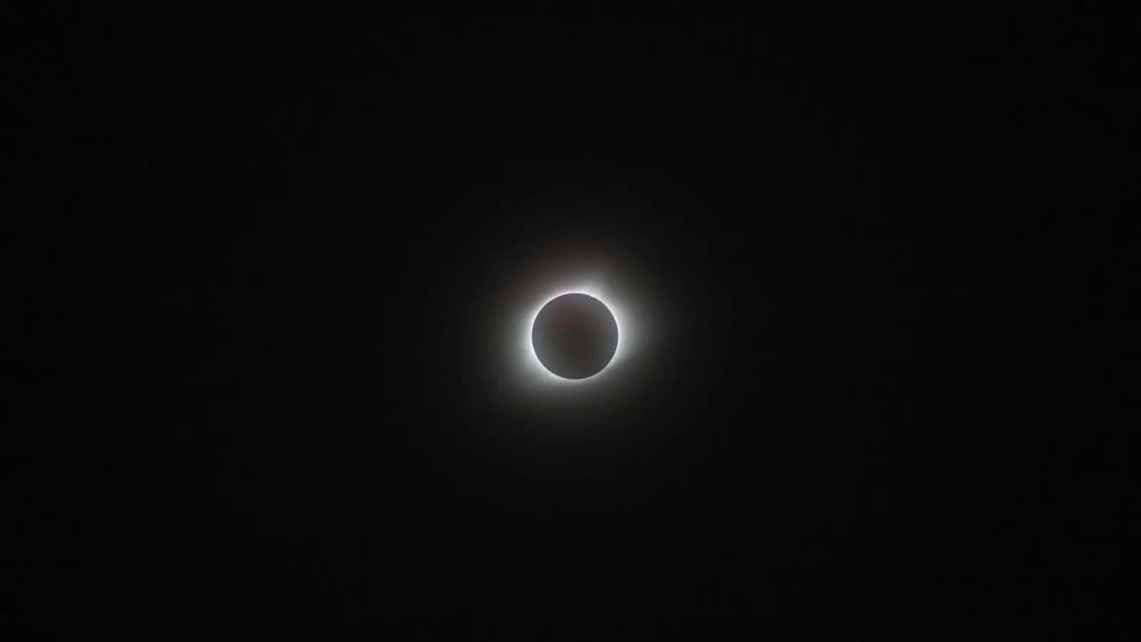 Total solar eclipse against a dark sky