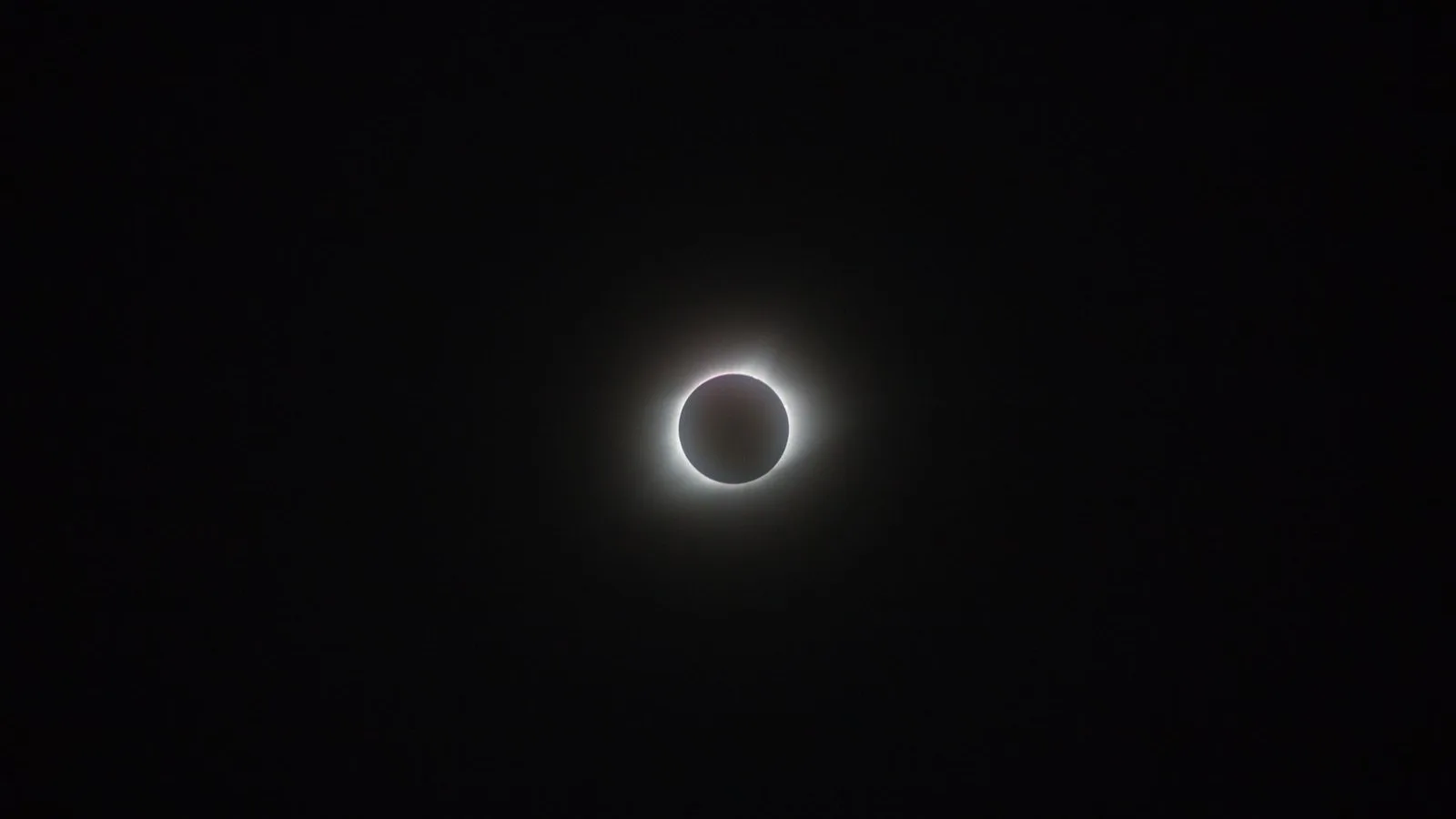 Total solar eclipse against a dark sky